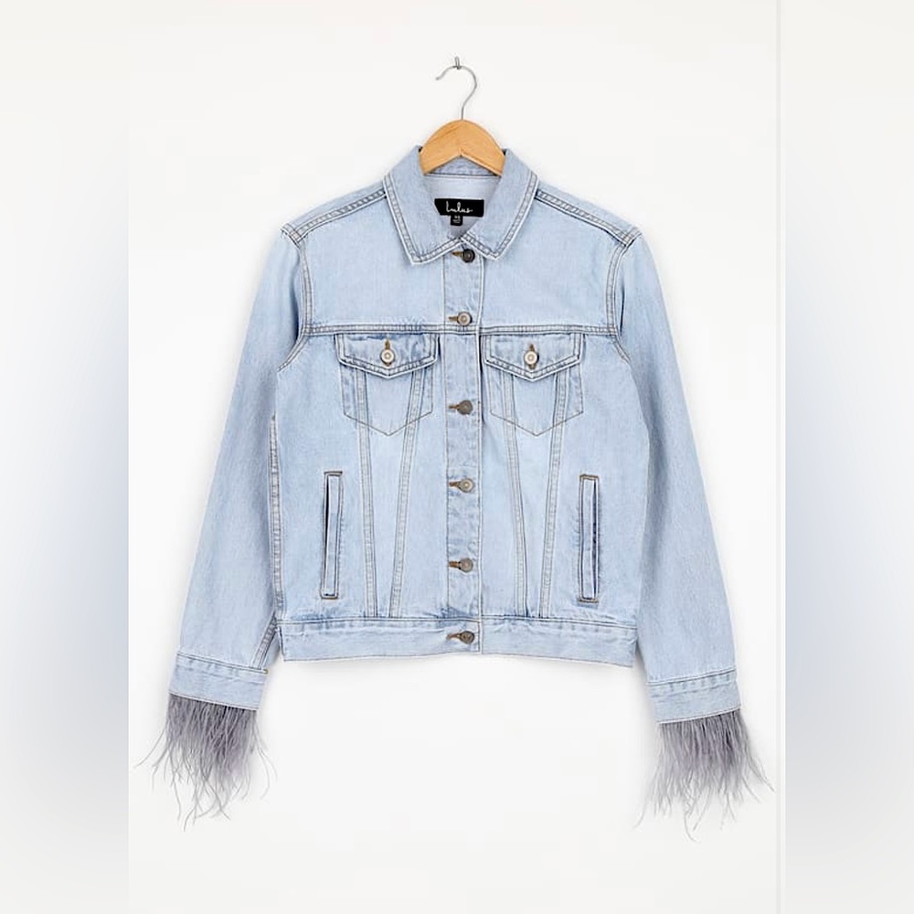 Light denim jean jacket with grey feathers around the sleeves!